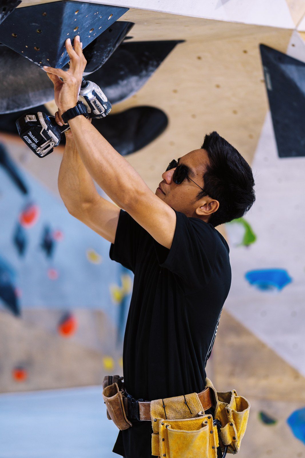 Coach working on a climbing movement close-up.